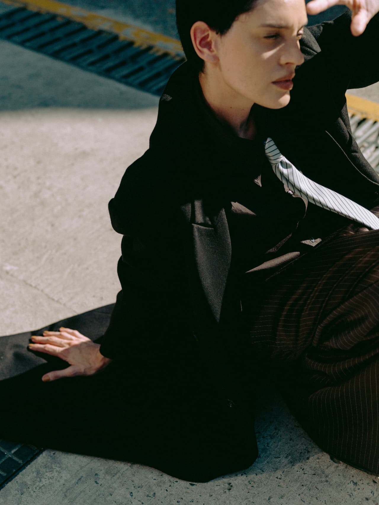 A professional seated outdoors in the city