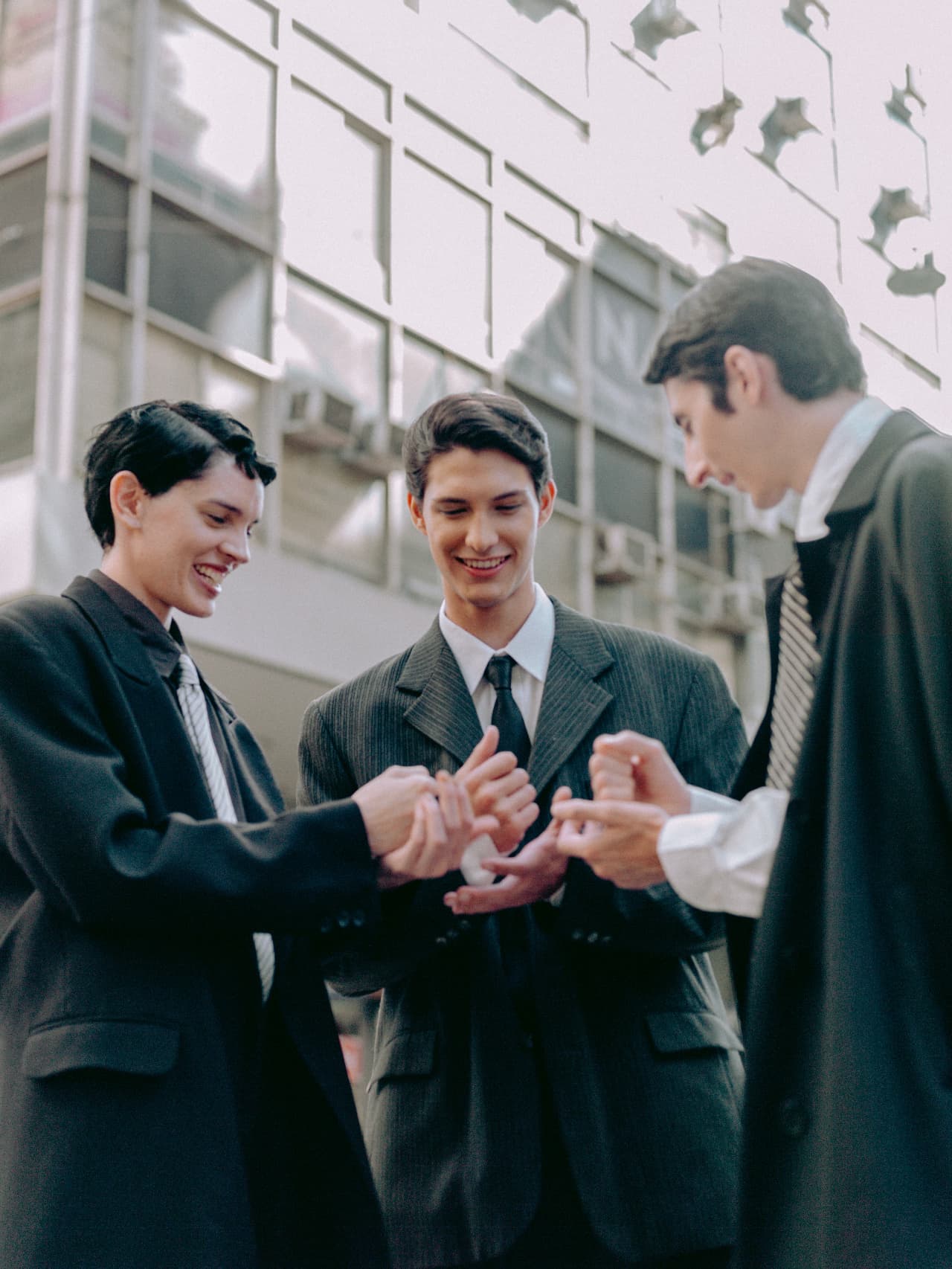 Three professionals sharing a light moment together